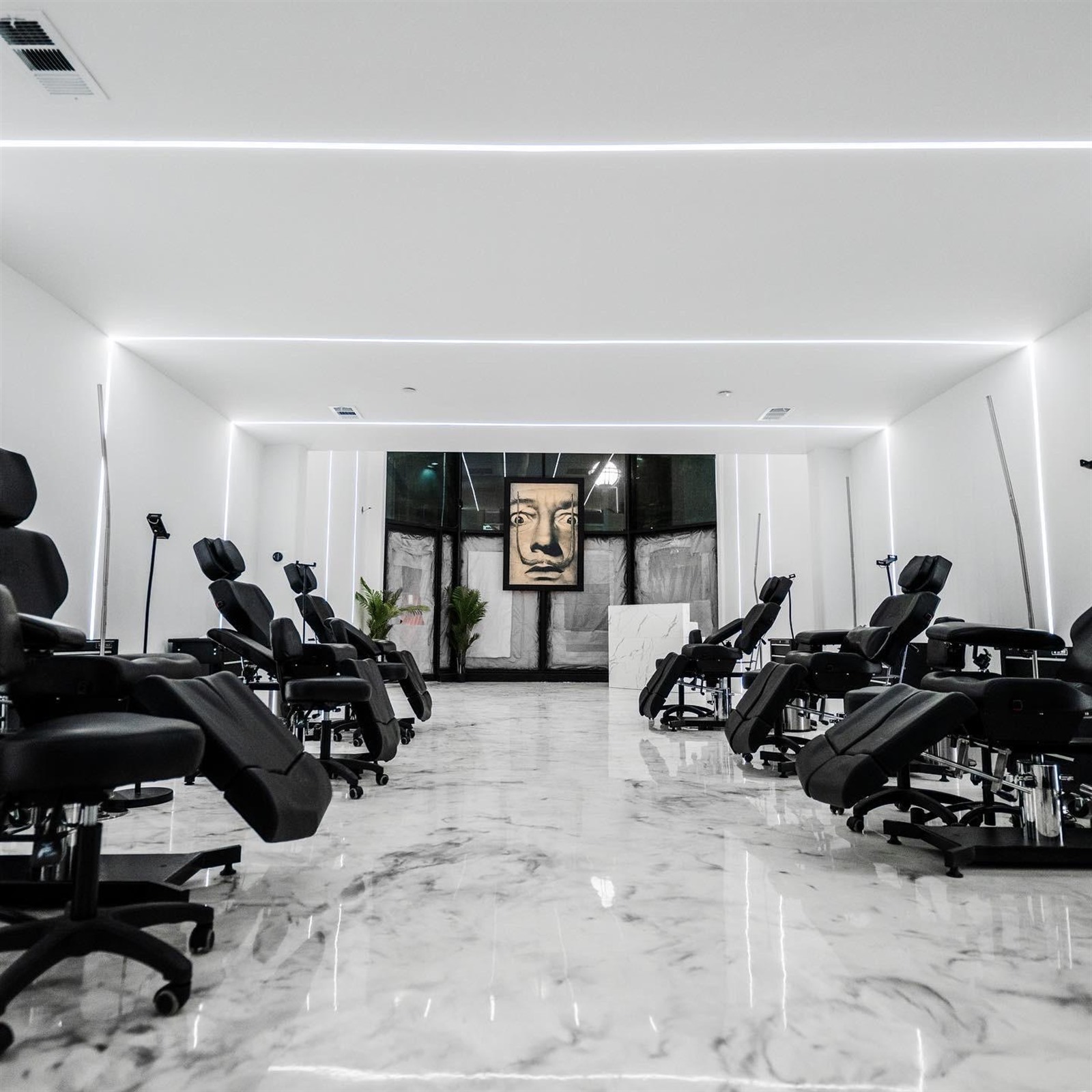 Linear ceiling reveal and cove lighting in a contemporary commercial interior by LIT Group, Los Angeles.