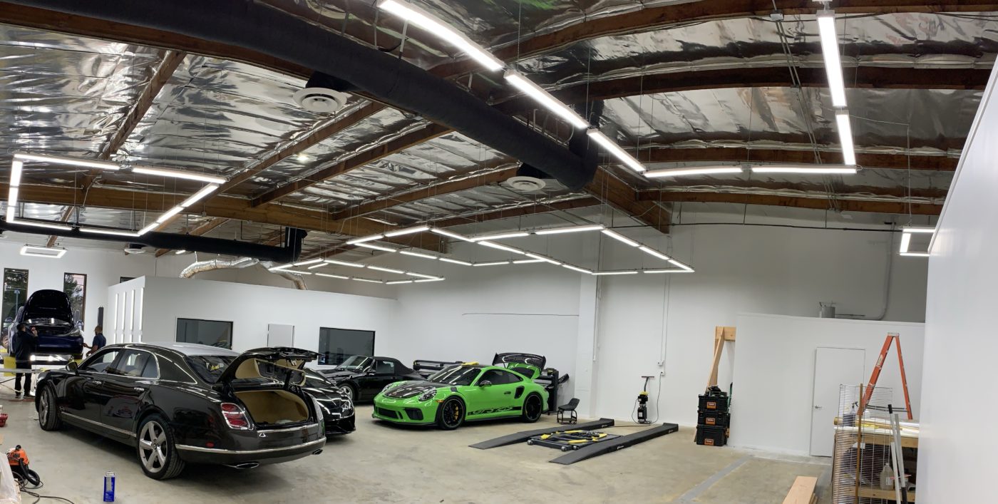 Architectural linear lighting in a Beverly Hills automotive gallery by LIT Group.
