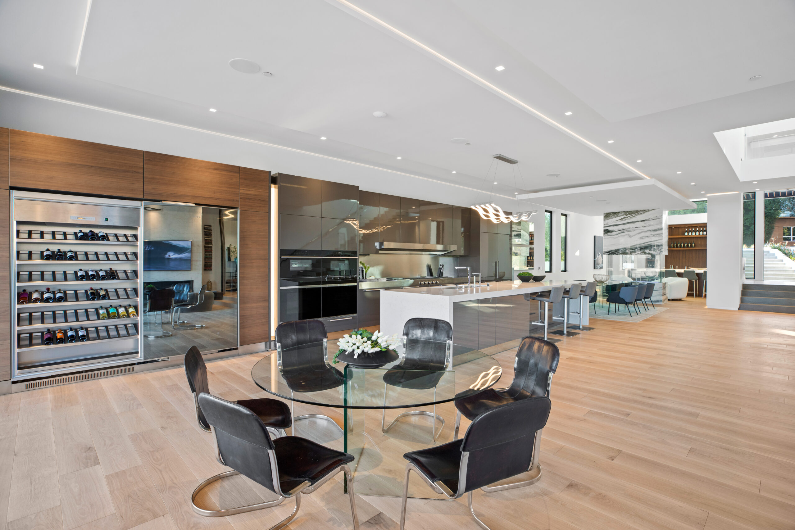 Integrated architectural LED lighting in a high-end residential kitchen by LIT Group.
